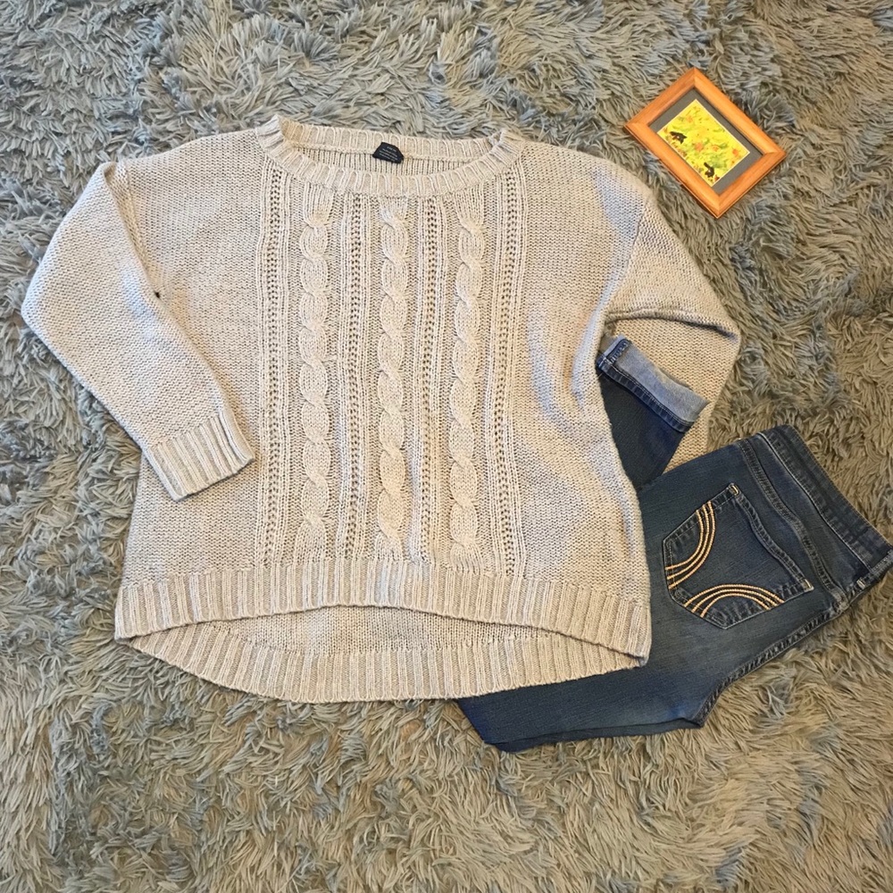 Gray knitted sweater.